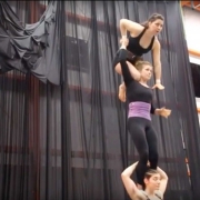 photo of three women performing a three high for the show Fractured, at the NEw England CEnter for Circus Arts