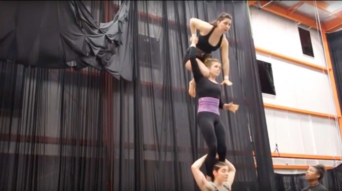 photo of three women performing a three high for the show Fractured, at the NEw England CEnter for Circus Arts